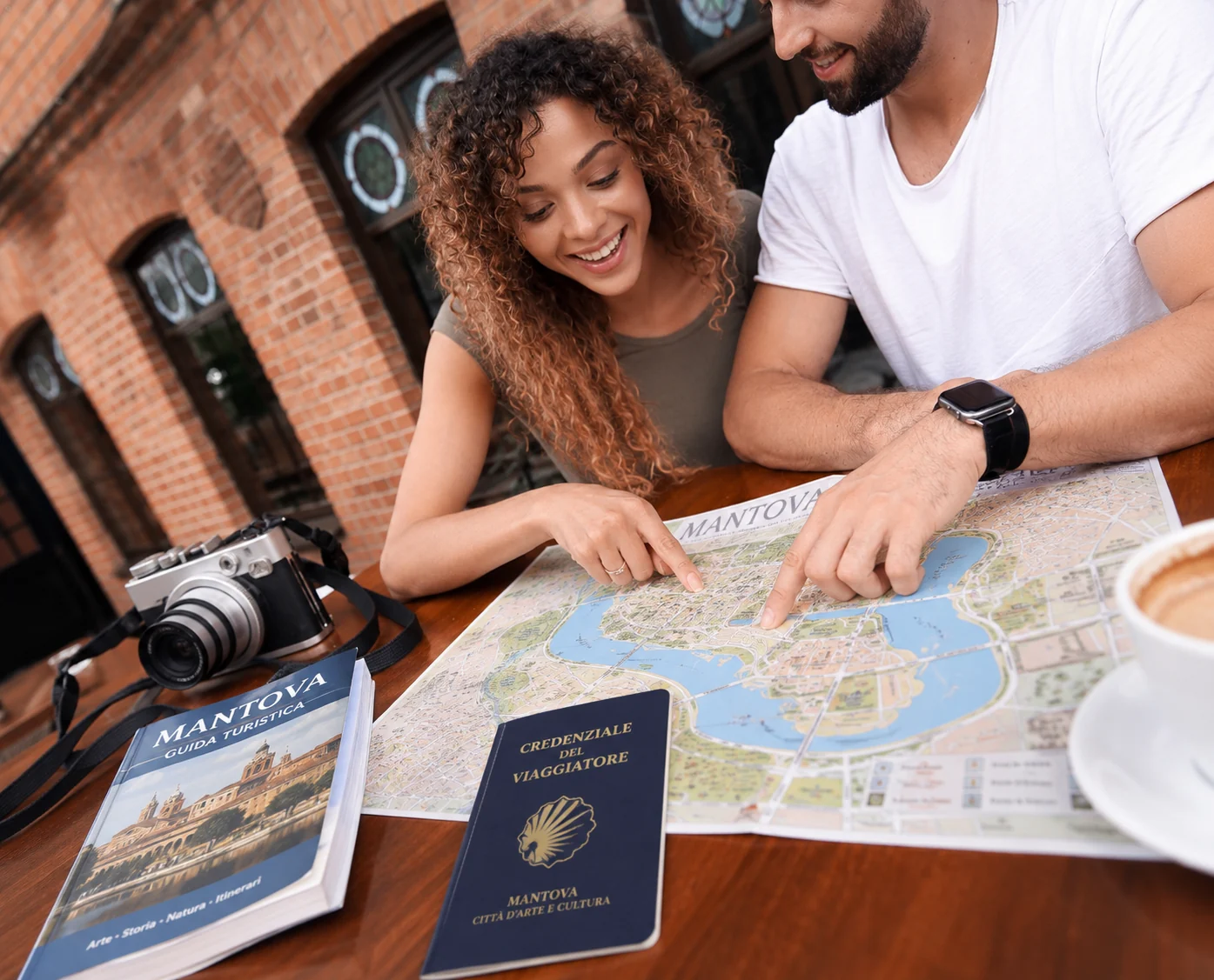 Couple planning an itinerary in Mantua with a map and traveler credential